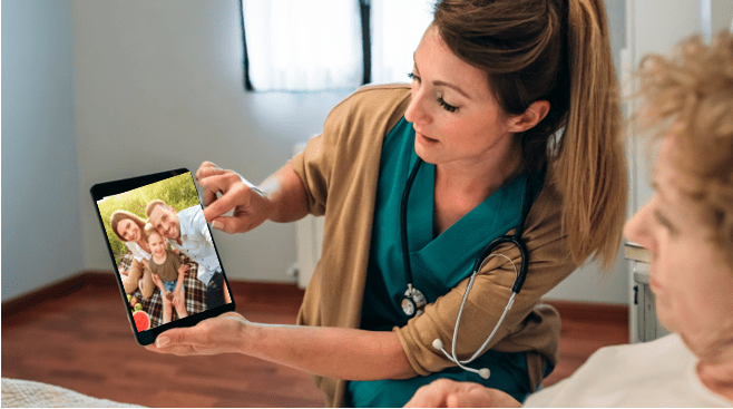 nurse uses ipad to support communication